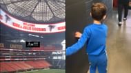 Kirk Cousins and his family viewing the Falcons' welcome banner at Mercedes-Benz Stadium